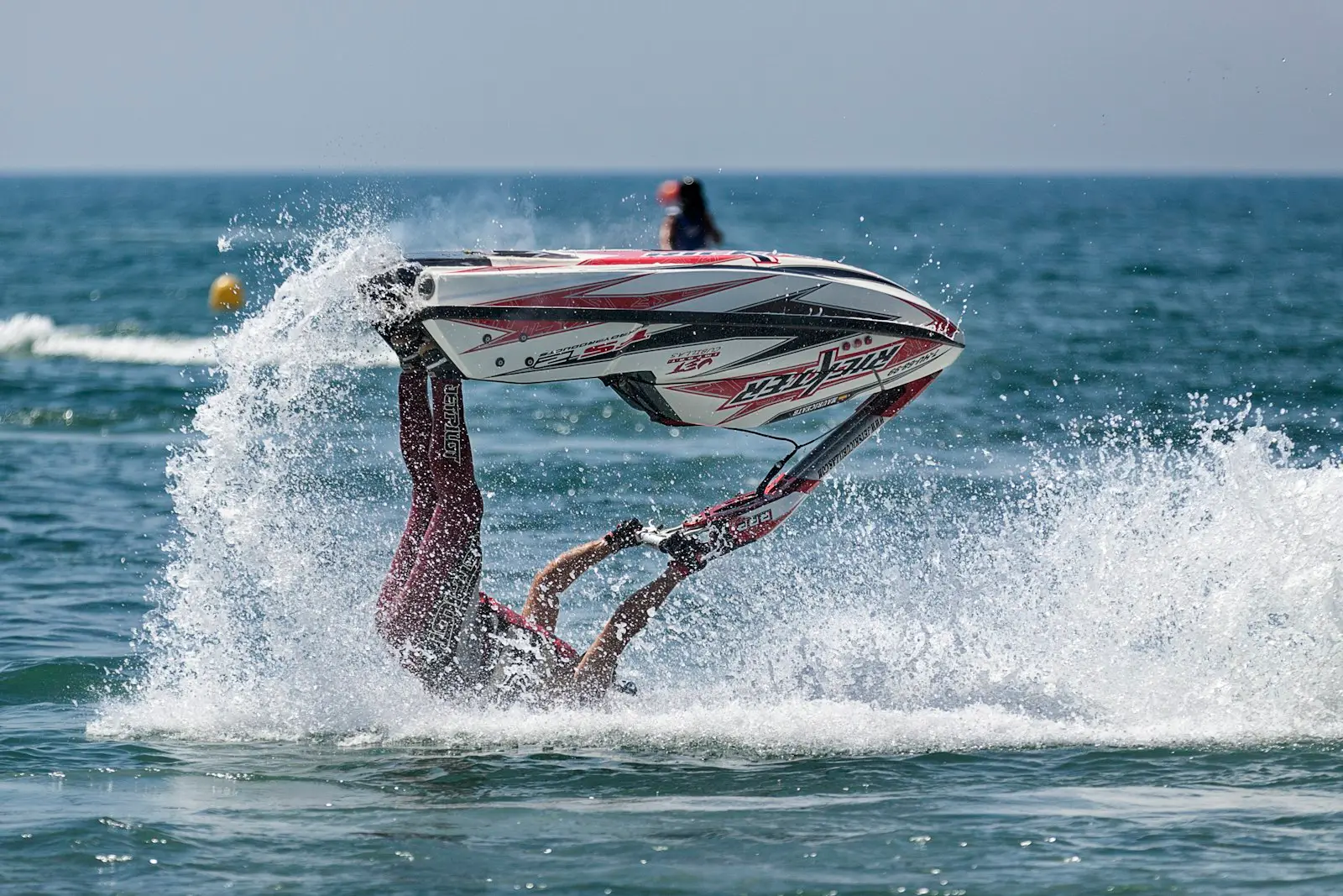 Jet ski catching air with a dramatic water trail